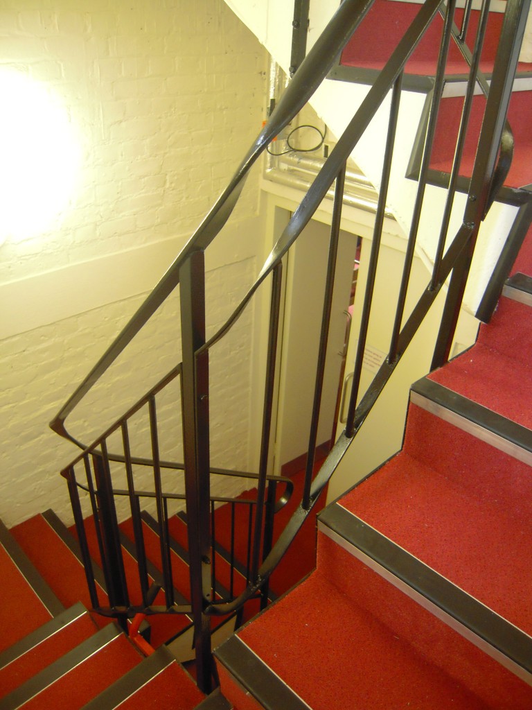 Metal banisters on steep stairs in St James Church in Gerrards Cross.