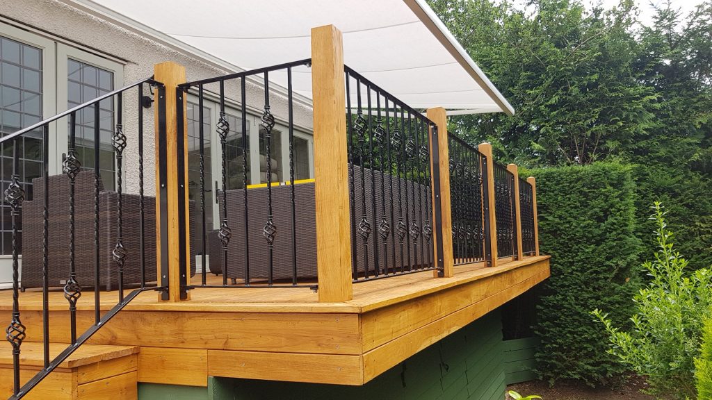 Railing fence panels fitted to a deck in Northwood.