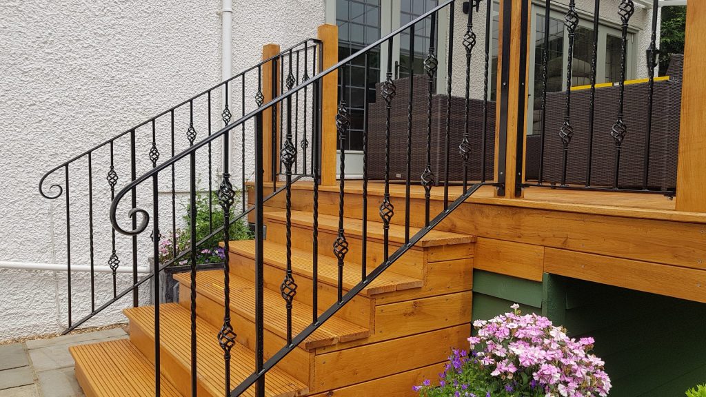Detail of custom-made railing panels fitted to steps at a property in Northwood.
