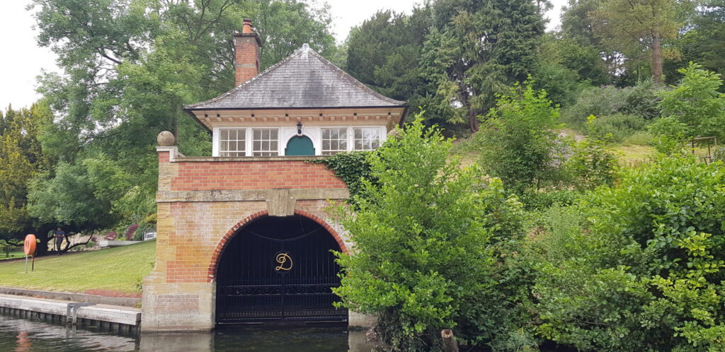 A boat house by the River Thames with custom-made riverside gates.