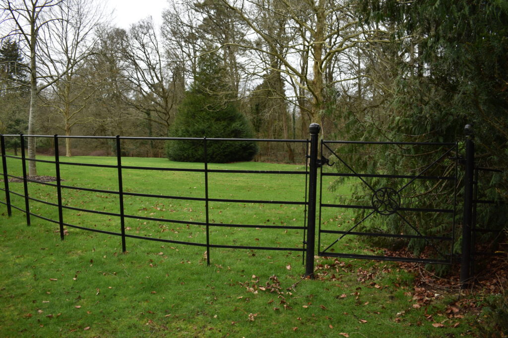 A close-up view of metal estate fencing and gates.