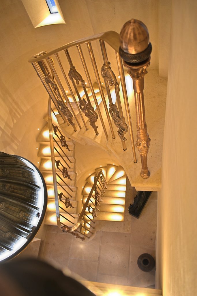 Detail of solid bronze balustrade on bespoke spiral staircase.