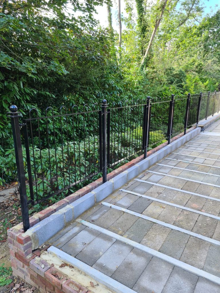 Metal fence rails made and fitted by The Blacksmith Shop.