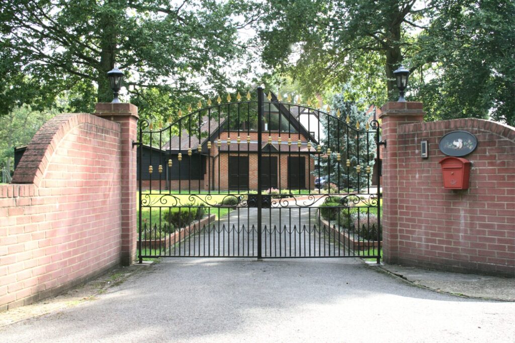 Stunning wrought iron gates made to measure to fit this prestigious entrance.