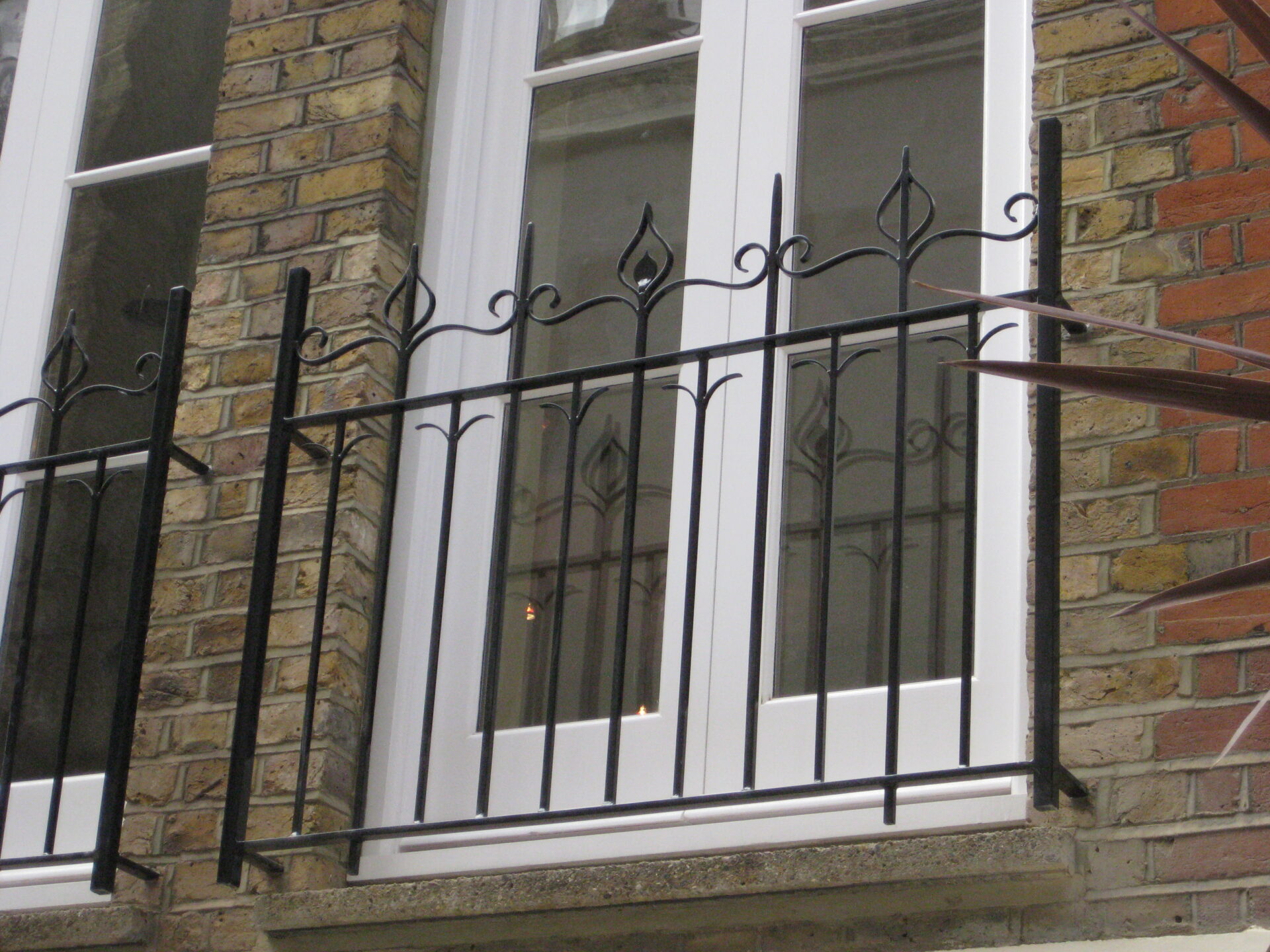 Detailed view of wrought iron balcony railings.
