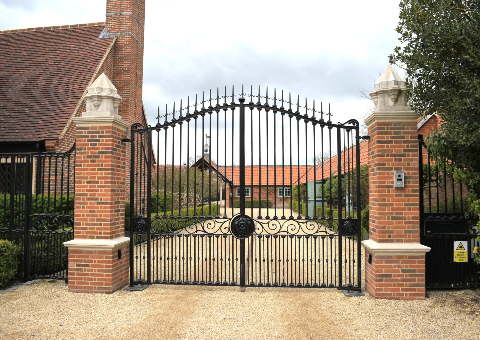 Stunning wrought iron gates and railings made by The Blacksmith Shop and installed at this prestigious entrance.